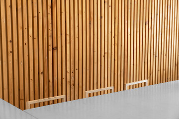 grey table with chair and wood line wall interior room background