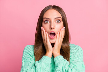 Close up portrait of shocked lady arms on cheeks open mouth wear turquoise pullover isolated on pink color background