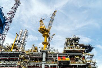 Fototapeta na wymiar A typical offshore pedestal crane on an oil production platform