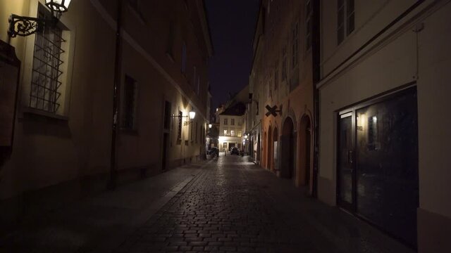 Empty narrow street in Prague center,Czechia,lanterns on houses,lockdown.