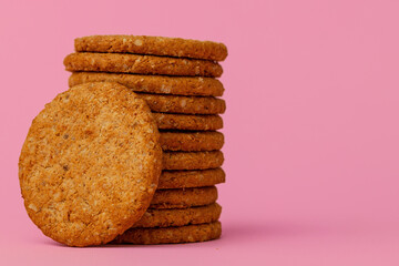 Stack of round oat cookies on paper background