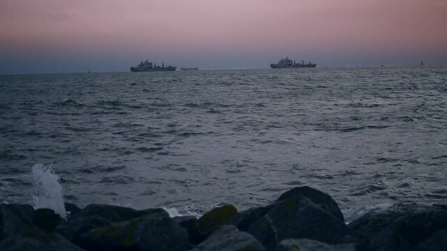Two large ships on the sun setting horizon 