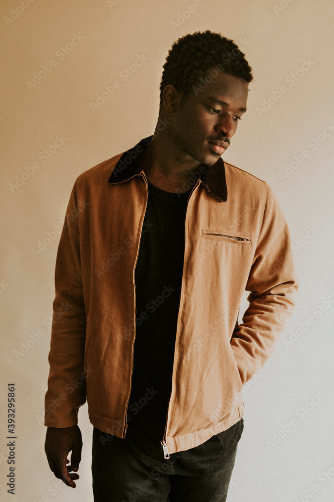 Wall mural Brown short jacket mockup on African Amercan male model in studio - Wall murals