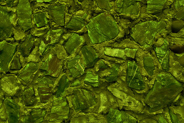 Abstract background made of large stone. Empty stone surface of green color.