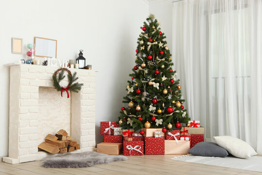 Beautiful interior decorated for Christmas or New Year. Christmas tree and gifts. Place for text