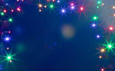 Christmas lights over dark blue background