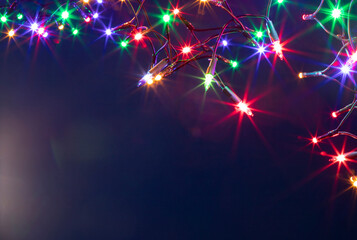 Christmas lights over dark blue background