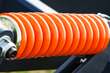 Industrial spring at agricultural machine