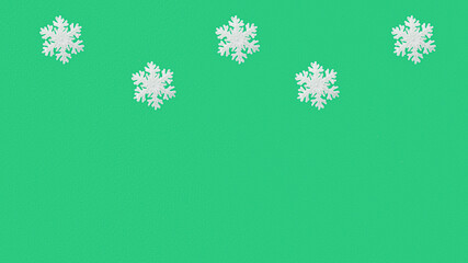 A Christmas banner featuring snowflakes on a green background. There is room for text. New Year and Christmas concept