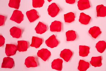 Valentines background with red rose petals, flat lay. Birthday, Mothers day, Valentines day greeting