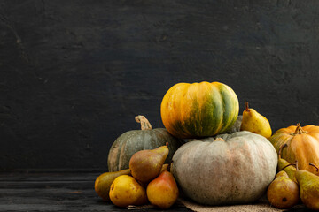 Pumpkins and pears on wooden table close-up