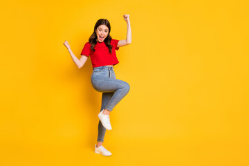 Full size photo of delighted girl celebrate win raise fists scream isolated over vibrant color background