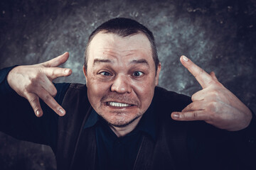 Middle aged social marginal emotional studio portrait.