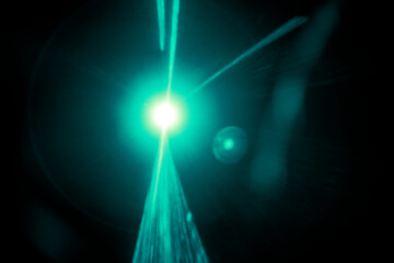 Green flare light effect on a black background wallpaper