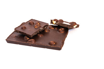 Pieces of milk chocolate with a whole nut