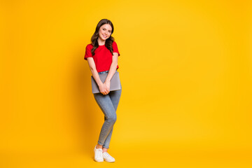 Fototapeta na wymiar Full length photo of positive girl hold laptop isolated over shine bright color background