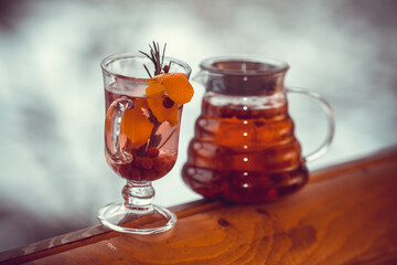 Hot tea in a glass pot and cup