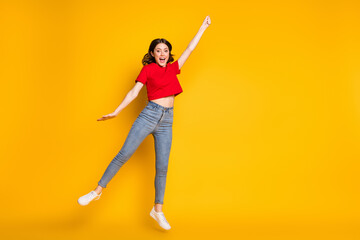 Fototapeta na wymiar Full length photo of positive girl jump hold hand air wind blow isolated over bright color background