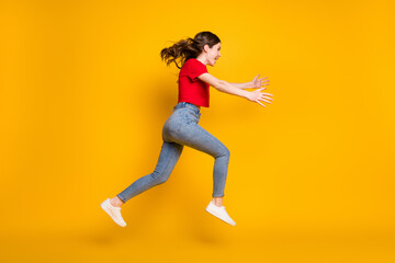 Fototapeta na wymiar Full length profile side photo of cheerful excited girl jump run open isolated over bright shine color background