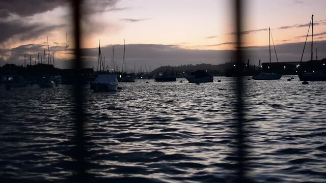 Low down shot of the sun setting over the harbour 