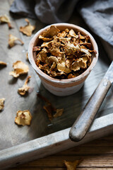 Organic dried chanterelle mushroom on wooden box