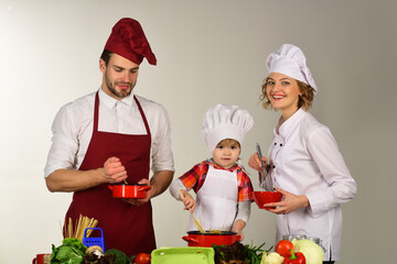 Family cooking. Happy family cooking together. Healthy food at home. Cooking in the home. Kitchenware. Lunch.