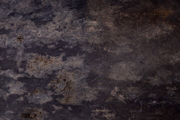 Grey slate background with rusty areas