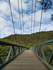 Fototapeta na wymiar Beautiful view of suspension foot bridge over a creek, Bobbin Head, Ku-ring-gai Chase National Park, Sydney, New South Wales, Australia 