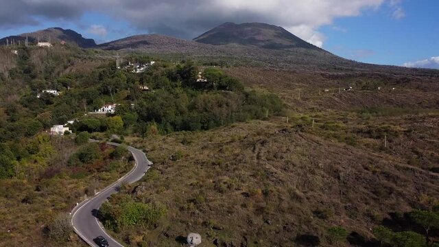 Aerial drone footage of Mount Vesuvius in South Italy on a sunny day. Naples