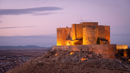 CONSUEGRA CASTLE LIGHTED AT SUNSET, SPAIN