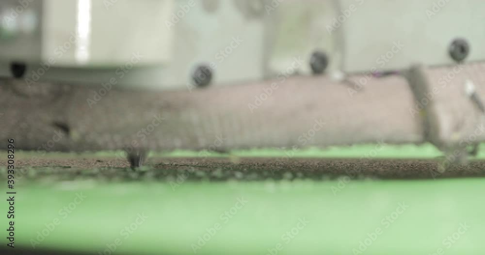 Aufkleber cnc router cutting machine at work - router bit cutting polyethylene plastic sheet in a factory - sl
