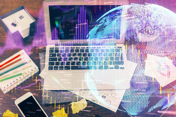 Double exposure of forex graph and work space with computer. Concept of international online trading.