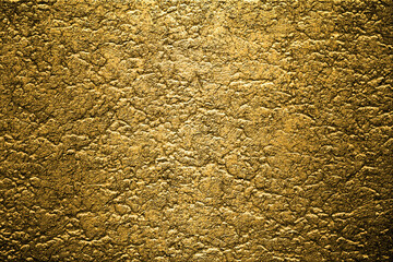 Golden Background. Old gold. Embossing technique. Golden wallpaper.