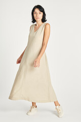 Woman in a minimal beige dress mockup