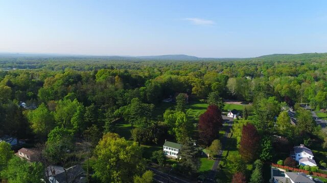 Beautiful Lush Trees in a Suburban Countryside - Rising Pull Back View