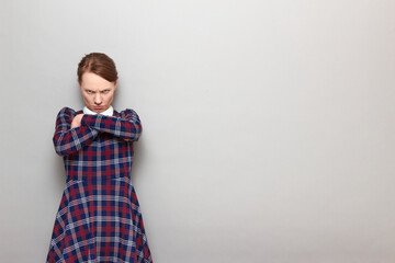Portrait of angry disgruntled girl holding arms crossed on chest