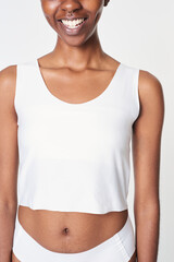 Woman in a white crop tank top and underwear