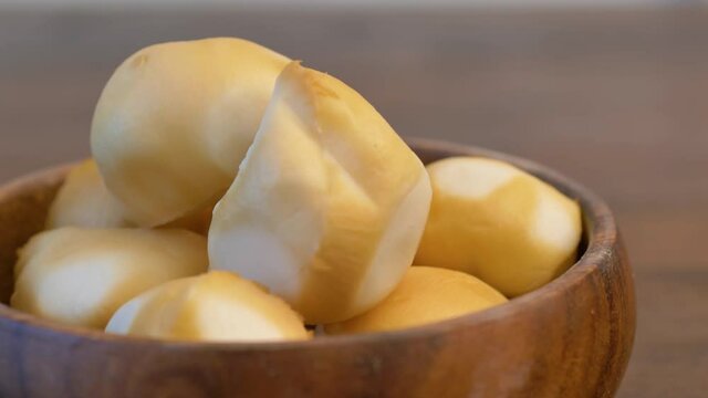 delicious morsels of scamorza cheese on wood bowl