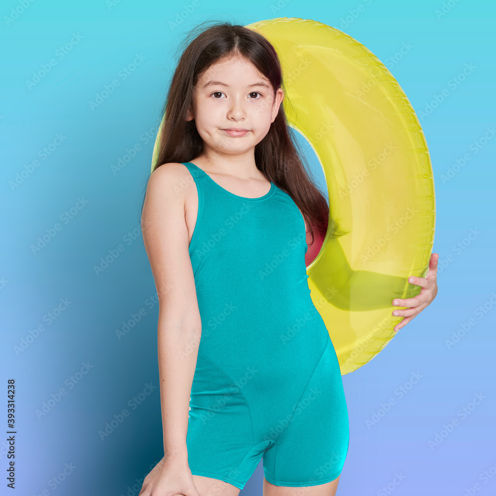 Canvas Prints Girl wearing swimwear holding a inflatable tube