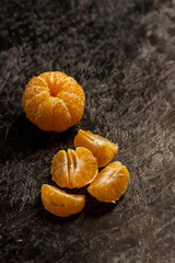 peeled tangerine on wooden background