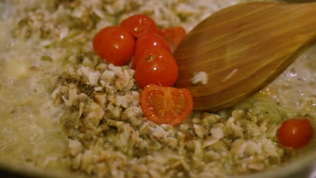 delicious clams without shell coocking with fresh cerry tomatoes