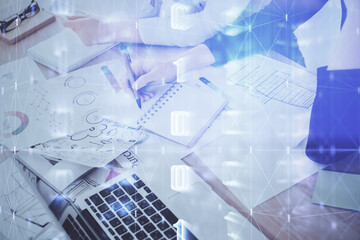 Double exposure of woman's writing hand on background with data technology hud. Big data concept.