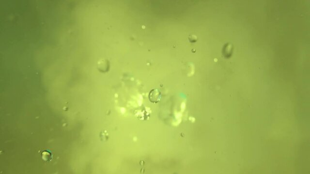 Relaxing videos with splashes and drops of water with fog with the ability to loop.Water splash in close-up.Swirl drip and jump water in motion.Chemical reaction water evaporation.Physical phenomenon