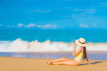 Portrait beautiful young asian woman relax smile leisure around outdoor sea beach ocean