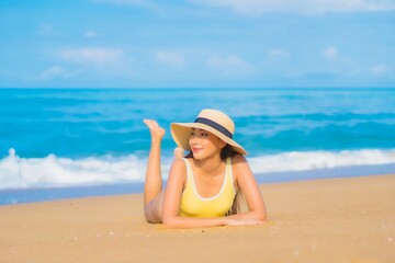 Portrait beautiful young asian woman relax smile leisure around outdoor sea beach ocean