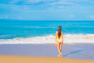 Portrait beautiful young asian woman relax smile leisure around outdoor sea beach ocean