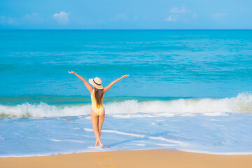 Portrait beautiful young asian woman relax smile leisure around outdoor sea beach ocean