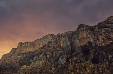 Fototapeta premium Canyon crossed by a river at sunset. Lumbier canyon next to the irati river at sunset