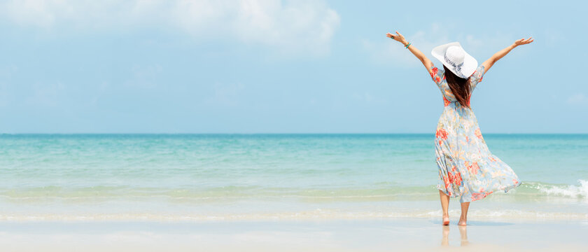 Summer Vacation. Lifestyle Woman Raise Arm And Hand On Wave Relax And Happy On Beach Tropical Outdoor In Summer Day. Young People Luxury And Destination In Holiday. 