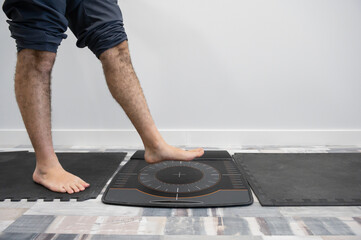 Man's foot on a pressure platform for the biomechanical study of footfall